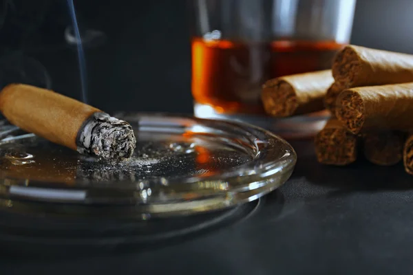 Cigars and burning one with whiskey — Stock Photo, Image