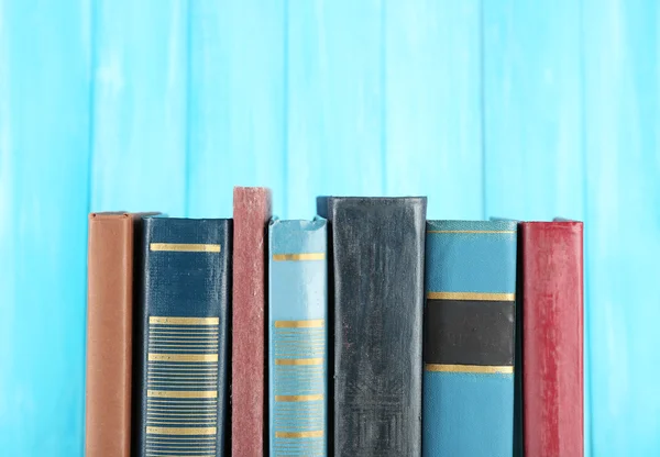 Retro books on turquoise — Stock Photo, Image