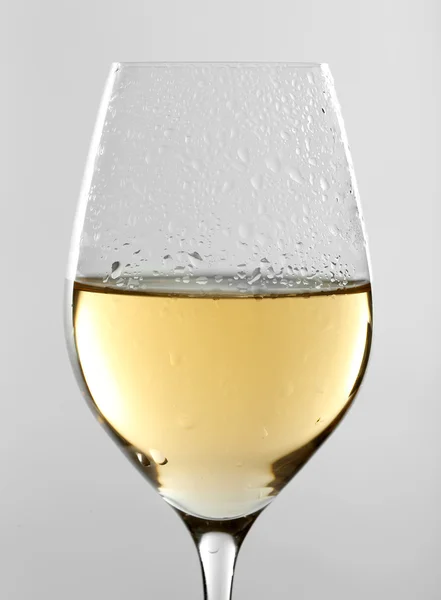 Glass of wine on grey background — Stock Photo, Image