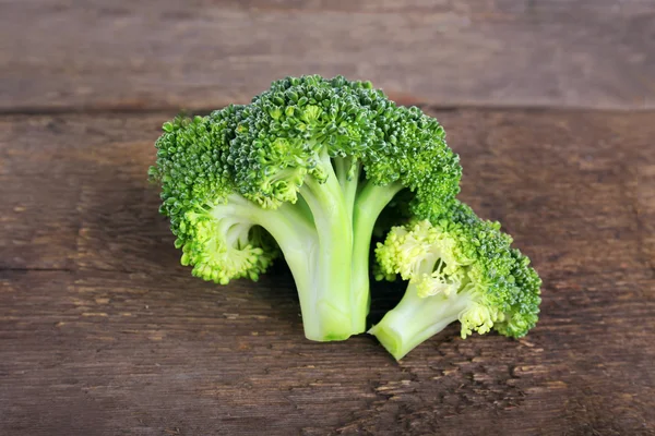 Fresh broccoli on wooden background — Stock Photo, Image