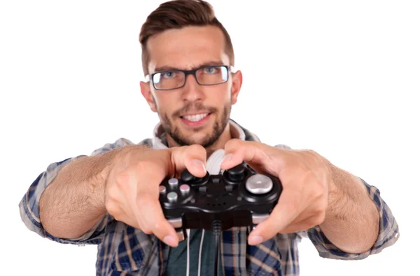 Junger Mann spielt Videospiele isoliert auf weiß — Stockfoto