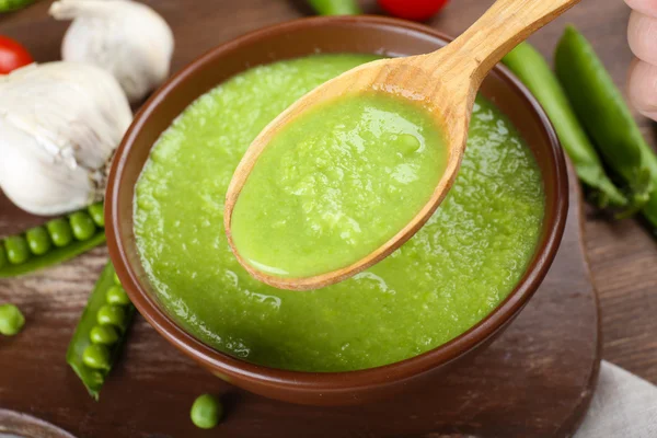 Tasty peas soup and vegetables — Stock Photo, Image
