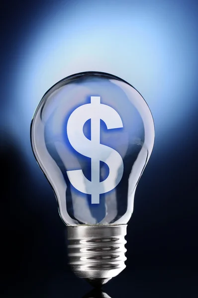 Light bulb with Dollar symbol on dark background — Stock Photo, Image