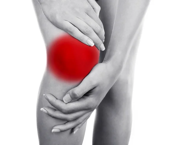 Mladá žena s bolest kolena — Stock fotografie