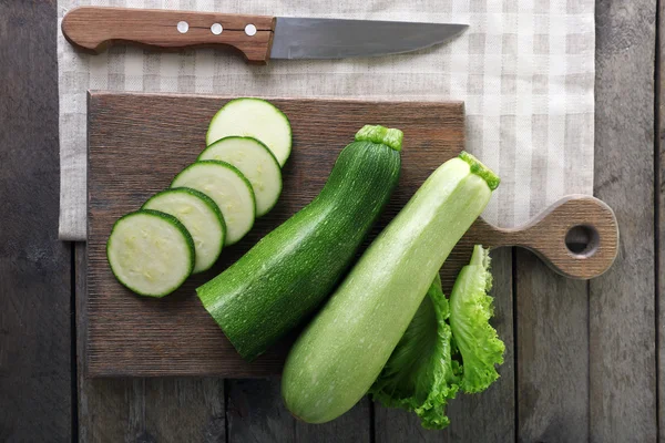 Fresh zucchini with squash on cutting board — Stock Photo, Image