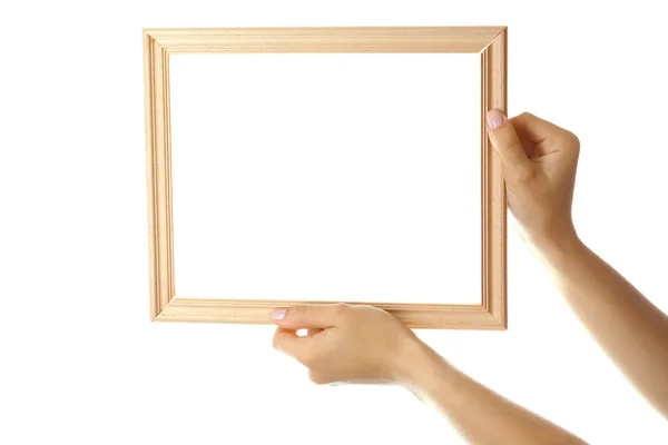 Vrouwelijke handen met houten frame, geïsoleerd op wit — Stockfoto