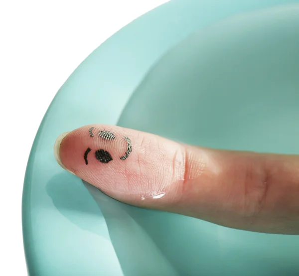Finger with funny smiles in pool — Stock Photo, Image