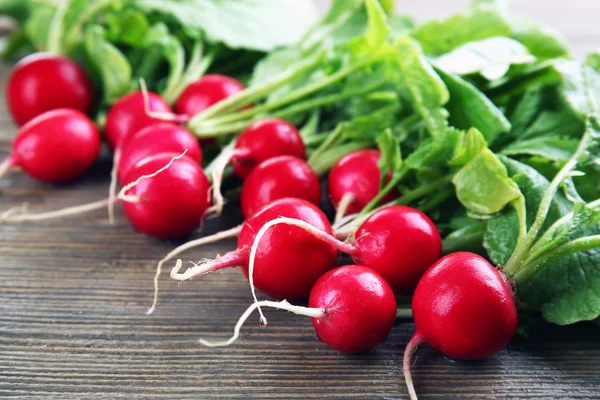 Fresh red radish on wooden table, closeup — Stock Photo, Image