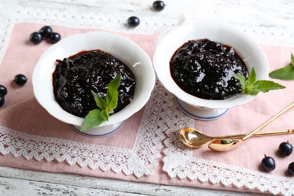 Currant jam with berries on table — Stock Photo, Image