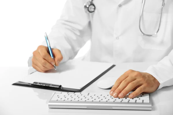 Doctor working at table — Stock Photo, Image