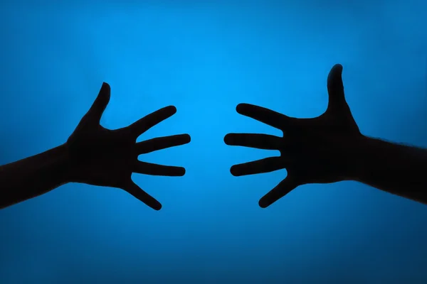 Silhouette of hands close up — Stock Photo, Image