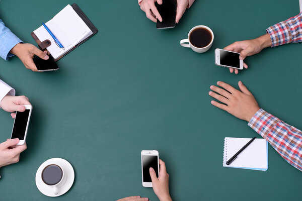 Top view of people hands at working process