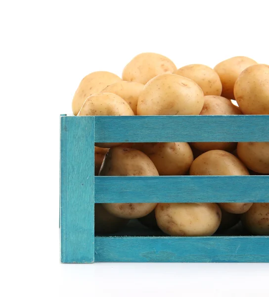 New potatoes in wooden table — Stock Photo, Image