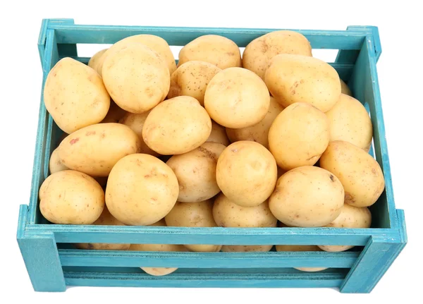 New potatoes in wooden table — Stock Photo, Image
