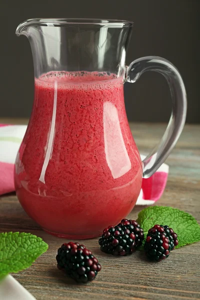 Glass jug of blackberry smoothie — Stock Photo, Image
