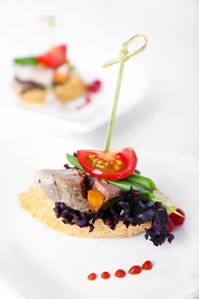 Tasty canapes on wooden table, close up — Stock Photo, Image