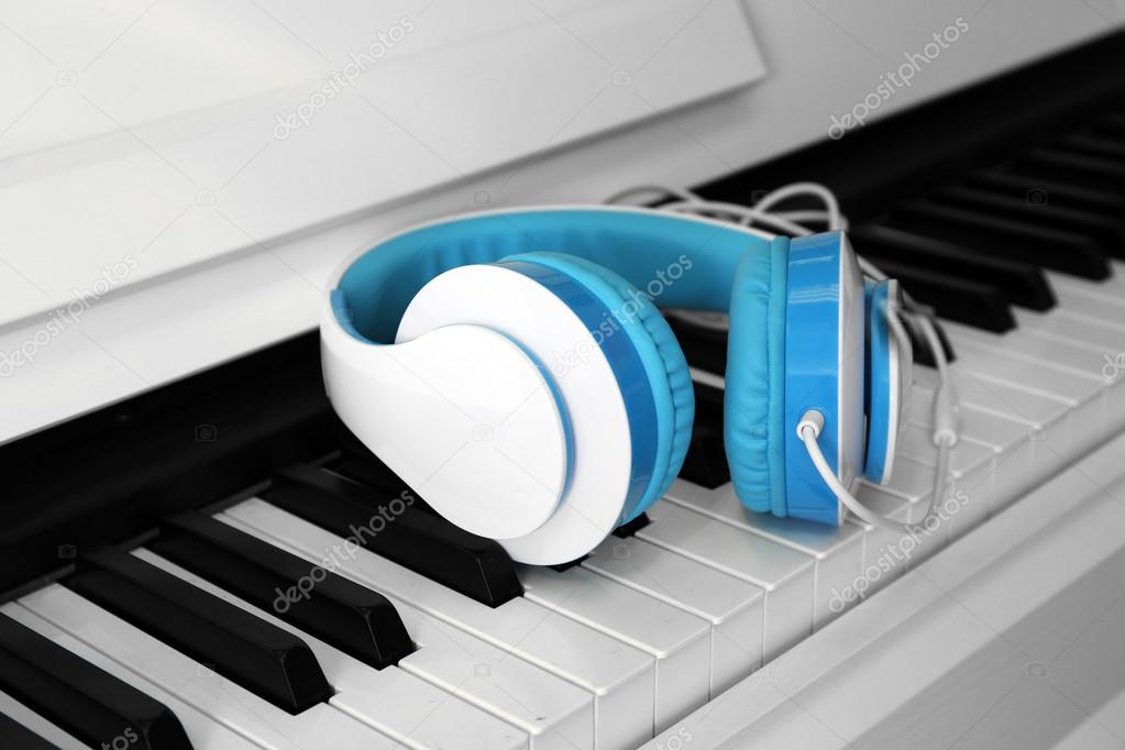 Piano with headphones close up