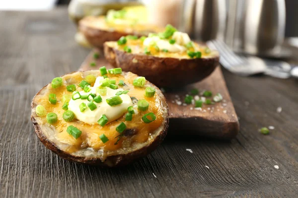 Baked potato with mayonnaise and chives — Stock Photo, Image