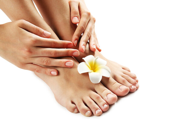 Female feet at spa pedicure procedure