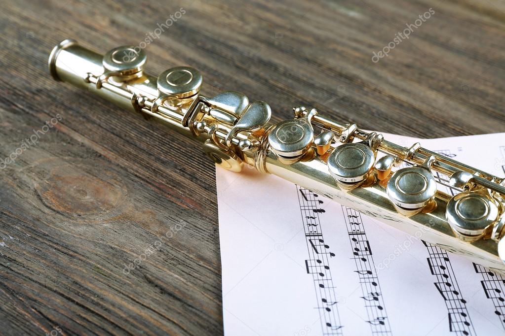 Silver flute with music notes