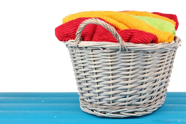 Colorful towels in basket — Stock Photo, Image