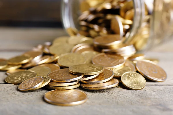 Glass jar with coins — Stock Photo, Image