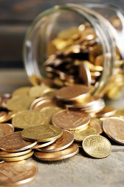 Glass jar with coins — Stock Photo, Image