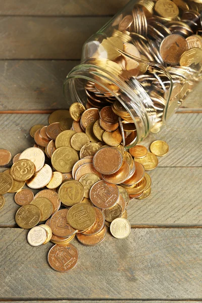 Glass jar with coins — Stock Photo, Image