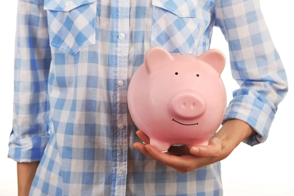 Handen met roze piggy bank — Stockfoto