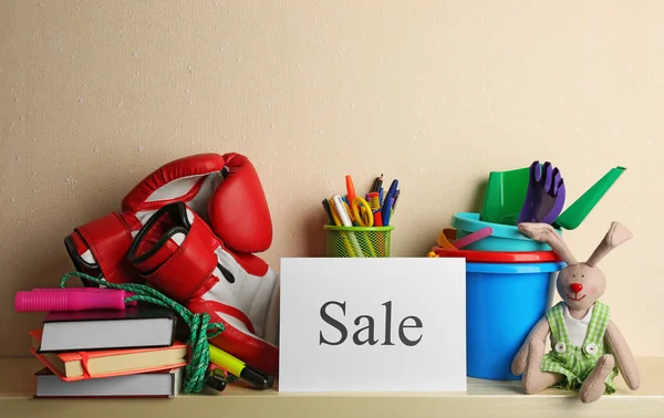 Goods for sale, on light wall background — Stock Photo, Image