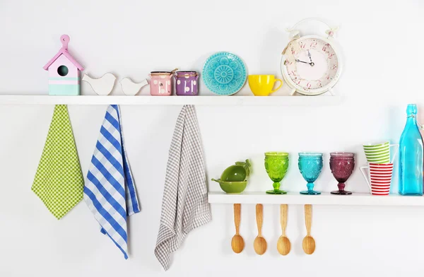 Kitchen utensils on wooden shelves — Stock Photo, Image