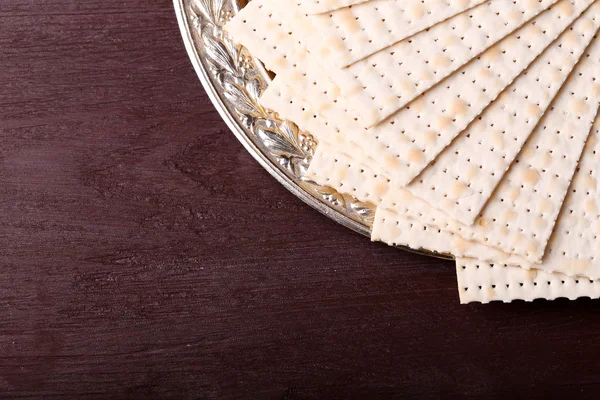 Matzo for Passover on metal tray on table close up — Stock Photo, Image