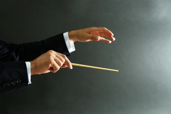 Music conductor hands with baton — Stock Photo, Image
