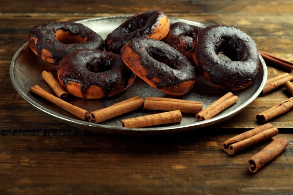 Delicious doughnuts with chocolate icing — Stock Photo, Image