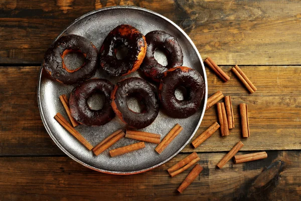 Delicious doughnuts with chocolate icing — Stock Photo, Image