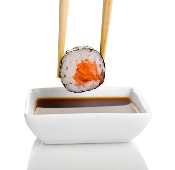 Dipping roll in sauce — Stock Photo, Image