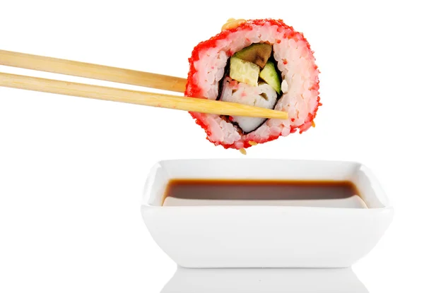 Dipping roll in sauce — Stock Photo, Image