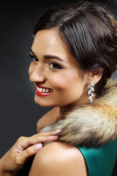 Retro style portrait of young woman on dark background — Stock Photo, Image