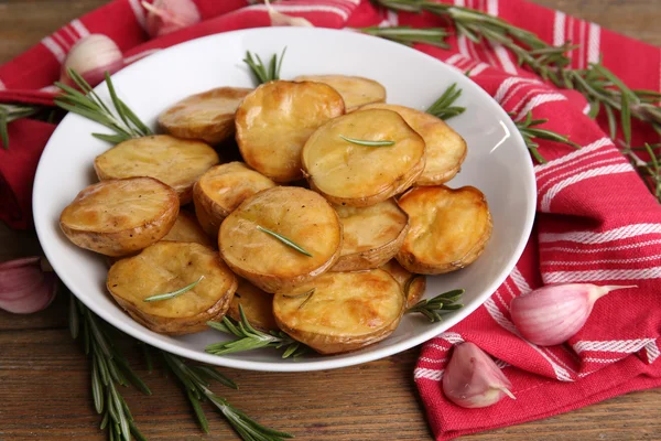 Delicious baked potato with rosemary — Stock Photo, Image