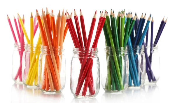 Bright pencils in glass jars — Stock Photo, Image