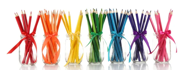 Bright pencils in glass jars — Stock Photo, Image