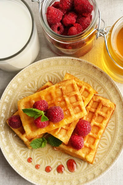 Sweet homemade waffles with fresh raspberries Stock Picture
