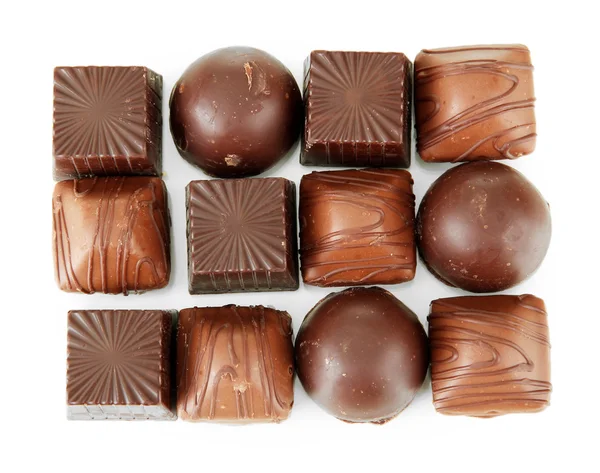 Doces de chocolate isolados em branco — Fotografia de Stock