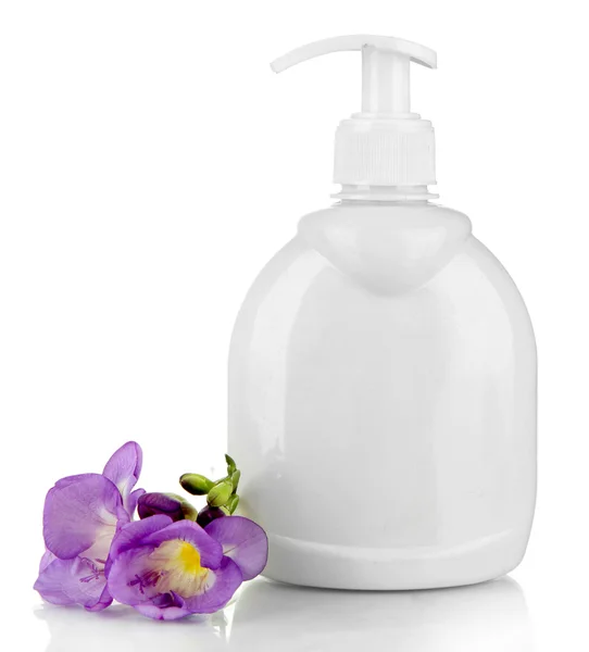 Láhev s tekutým mýdlem a květina — Stock fotografie