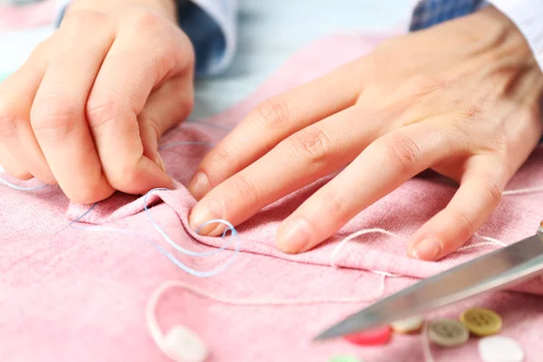 Closeup hands of seamstress at work — Stock Photo, Image