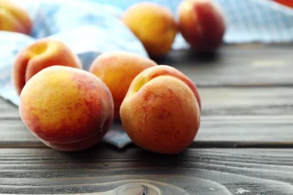 Sweet ripe peaches on table close up — Stock Photo, Image