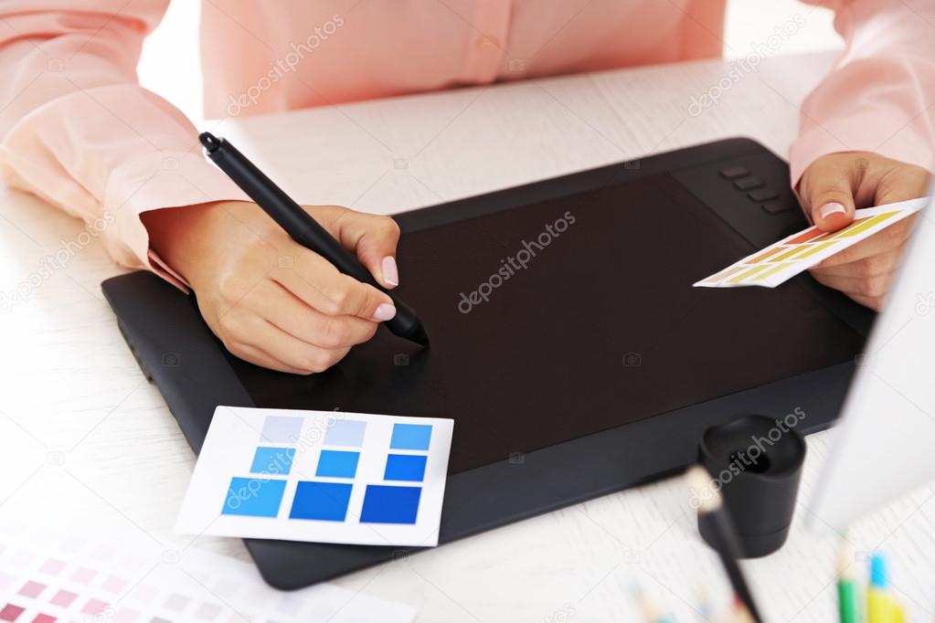 Artist drawing on graphic tablet