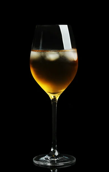 Glass of wine with ice cubes on dark background — Stock Photo, Image