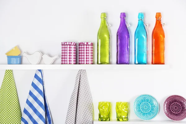 Kitchen utensils on wooden shelves — Stock Photo, Image