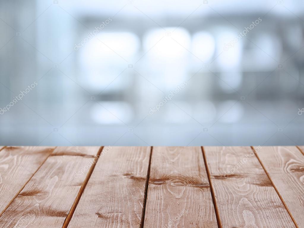 Wooden table with abstract blur background Stock Photo by ©belchonock  80817006